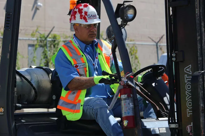 Forklift operator at the wheel during hands-on training